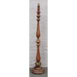 A mahogany turned standard lamp on circular base.