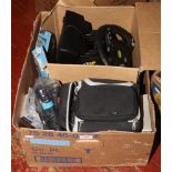 A box of gaming accessories, dual force racing wheel with pedals, PSP portable theatre, fair