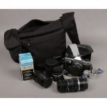 A Praktica 35mm MTL 5 B camera in protective case with various lenses 1600A electronic flash gun,