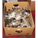 A box of silver plate to include candelabra, toast rack, teawares etc.