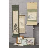 A collection of framed oriental prints, sampler and scrolls.
