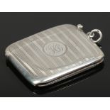 A Victorian silver vesta case by William Neale. Engraved with vertical bands and monogrammed H. B,