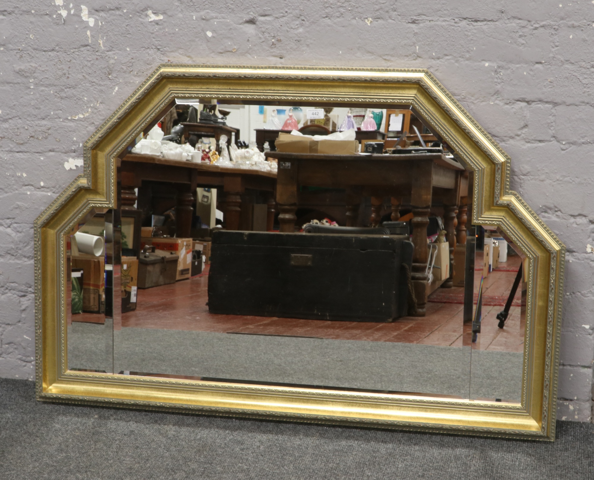 A bevel edge gilt framed over mantle mirror.