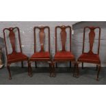 Four oak Queen Anne splat back chairs.