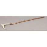 A bone handle walking stick.