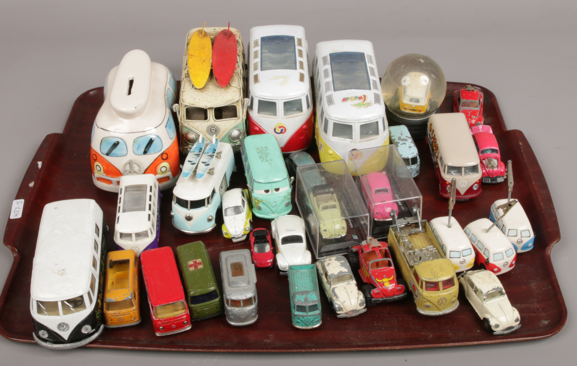A tray of Diecast and tin plate Volkswagen Beetle memorabilia.