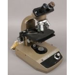 A Vickers Instruments electric binocular microscope.