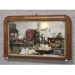 A Victorian mahogany over mantle mirror with pot supports.