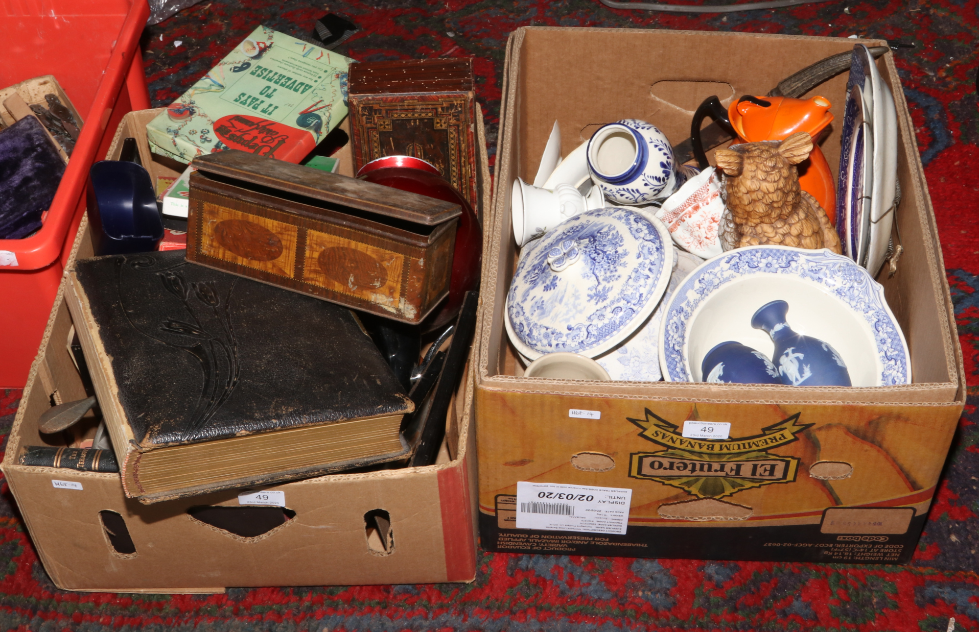 Two boxes of miscellaneous ceramics, tins, family bible, soda syphon, games etc.