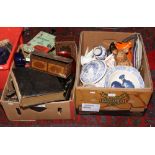 Two boxes of miscellaneous ceramics, tins, family bible, soda syphon, games etc.