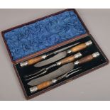 A vintage cased bone handle five piece carving set stamped Superior Cutlery Sheffield.
