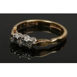 A ladies 18ct gold and platinum three stone diamond ring, size N, 2.87 grams.