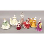 Seven ceramic figures of ladies to include Royal Doulton, Lladro and Coalport.