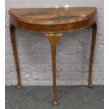 A chinoiserie demi lune side table.