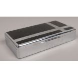 An Art Deco chrome plate table cigarette box with black vinyl decorations, 24cm.