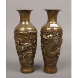 A pair of Chinese bronze vases decorated with Fenghuang and Dragon.