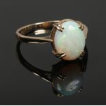 A ladies 9ct gold opal ring, size R, 2.76 grams.