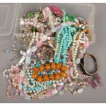 A box of costume jewellery beads, brooches, bangles etc.