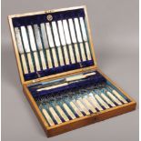 A canteen of Victorian silver plated cutlery by George Butler, the ivory handles decorated with game