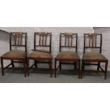 Four mahogany Regency dining chairs.
