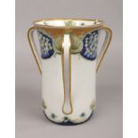 A James Macintyre & Co. Florian ware three handled vase designed by William Moorcroft. With gilt rim