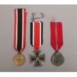 Three World War II German Third Reich medals, Iron Cross, War Merit and Russian Front.