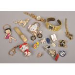 A box of costume jewellery to include Hello Kitty, Betty Boo keyrings, ladies quartz wristwatches,