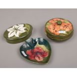 Three pieces of Moorcroft in the Hibiscus design to include potpourri pot, trinket box and a dish.