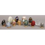 A collection of ornamental eggs to include ceramic and glass examples etc.