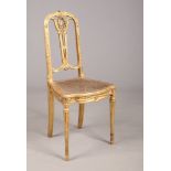 A 19th century French giltwood parlour chair with canework seat.