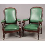 A pair of Regency mahogany library chairs. With reeded mouldings, scrolling arms and raised on