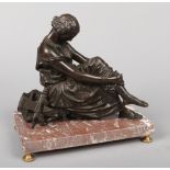 A 19th century Classical French bronze sculpture of Sappho. In seated pose with a lyre, raised on an