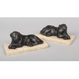After John Cheere, a pair of cast and tooled lead sculptures of lions on alabaster plinths, 24cm