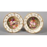 A fine pair of Rockingham dessert plates with anthemion and gadroon moulding painted by John