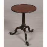 A Chippendale period carved mahogany dish top tripod kettle stand. With reeded centre pedestal and