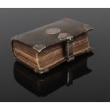 A 17th century leather bound pocket bible with engraved silver mounts. The Holy Bible Containing the