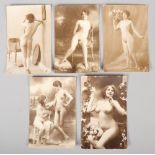 Five early 20th century monochrome erotic postcards. Some wear to the edges.