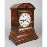 A 19th century German simulated rosewood cuckoo clock. With dome top, enamel dial having Roman