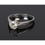A platinum and diamond solitaire engagement ring. Set with a brilliant cut diamond approximately 0.
