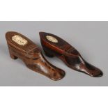 Two 18th century Continental novelty carved wooden snuff boxes formed as boots. Each decorated