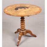 A 19th century Sorrento ware olive wood centre pedestal tripod table. With a marquetry roundel