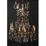 An early-mid 20th century French gilt metal and cut crystal eight branch chandelier, 90cm. Good