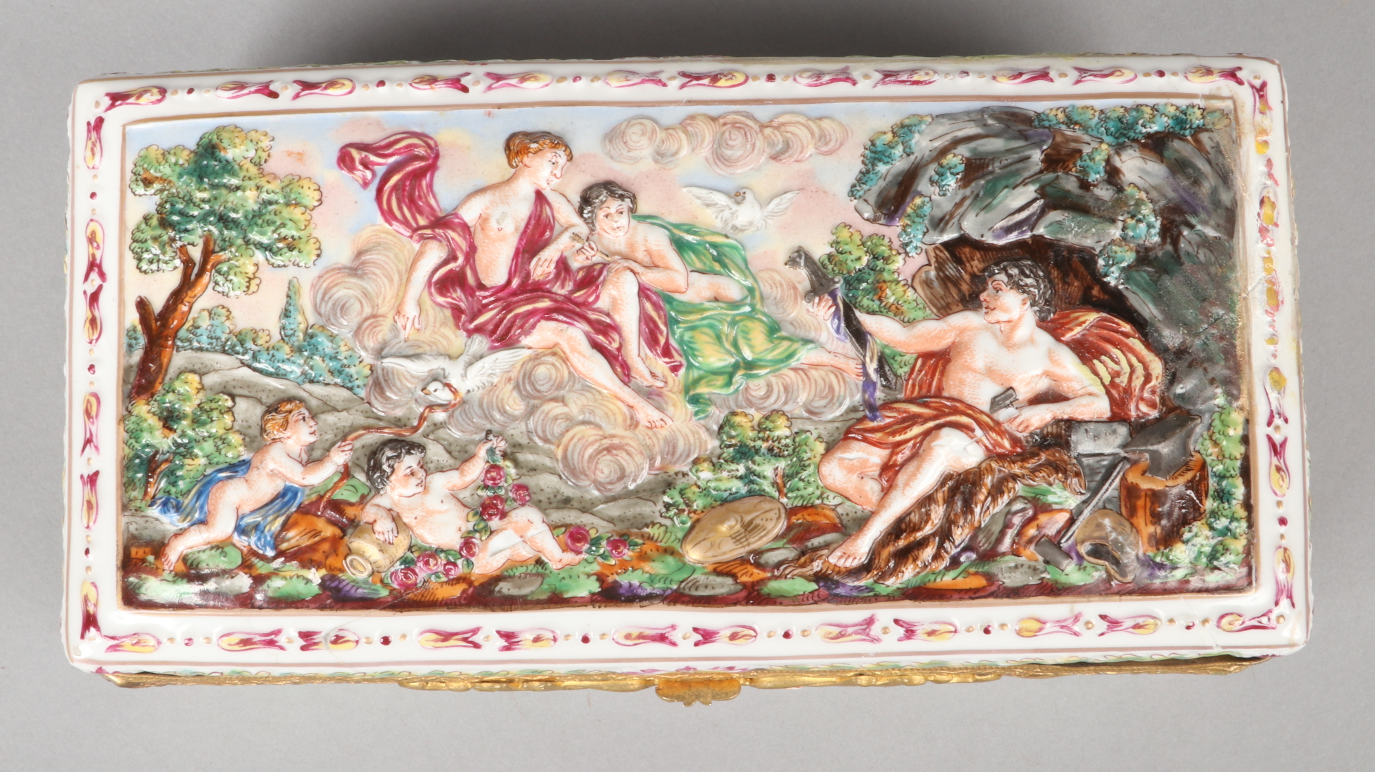 A Capodimonte casket with gilt metal mount, 21.5cm wide. Badly broken and re glued. - Image 2 of 2