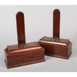 A pair of 19th century Gillows style weighted mahogany charger stands,