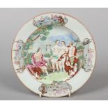 A Chinese famille rose plate painted with a scene depicting the Judgement of Paris within a border