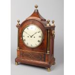 A Regency inlaid mahogany bracket clock. With brass finials, lion mask handles, ionic column