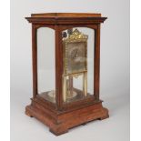 An oak cased four glass torsion clock by Gustav Becker. With rectangular silvered dial with Arabic