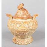 A 19th century salt glazed stoneware sucrier and cover. With flower finial, loop handles and