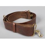 A World War I pattern British Army leather belt with serpent formed brass buckle. Good condition.