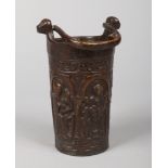 A 19th century patinated bronze holy water bucket with swing handle after a Gothic original. With